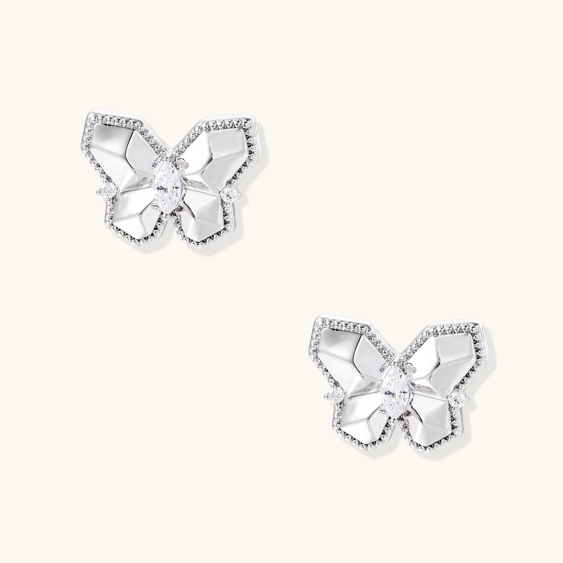 Delicate gold-plated butterfly stud earrings with zirconia crystals outlining wings and marquise center stones