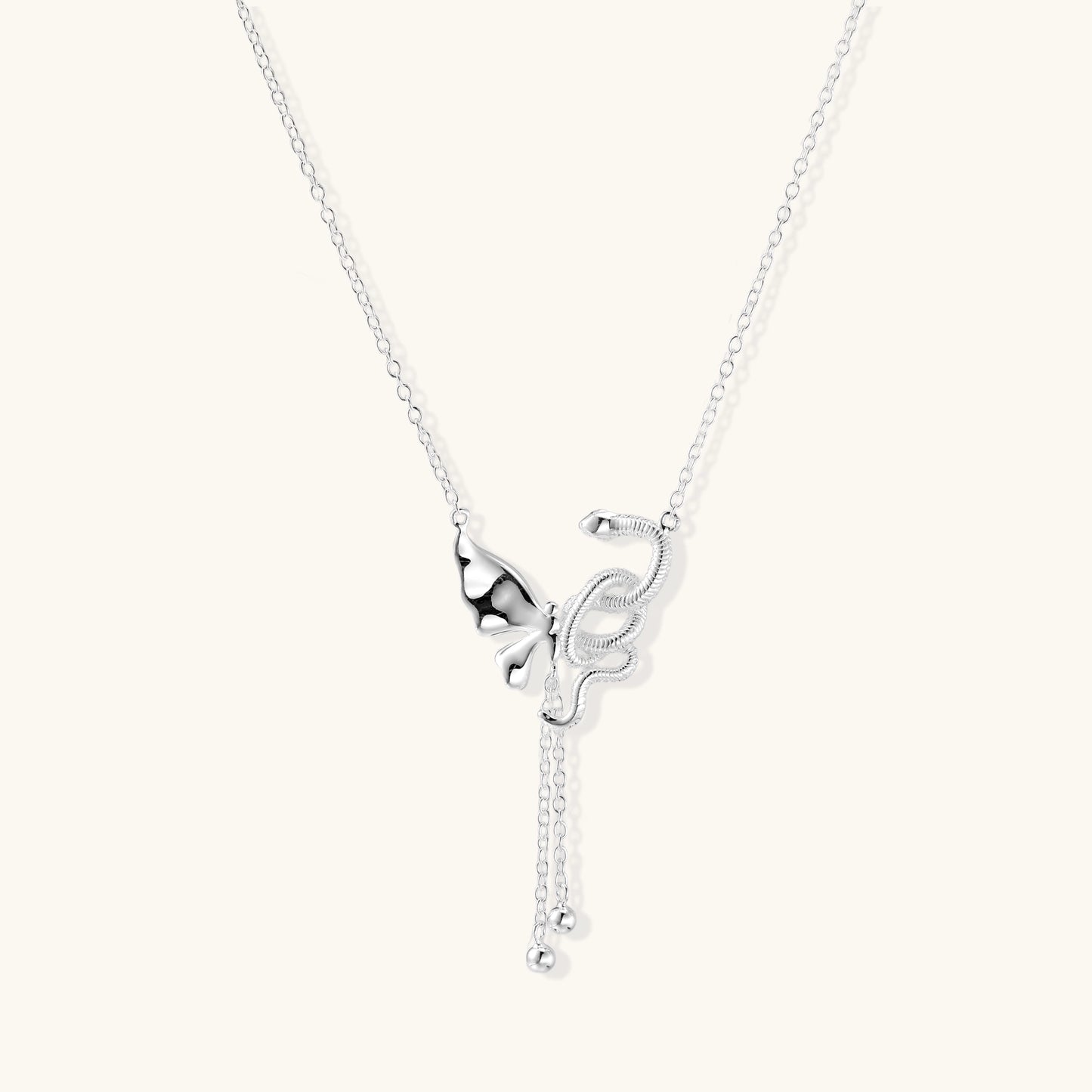 Delicate sterling silver butterfly pendant necklace with textured wing details and adjustable chain on white background