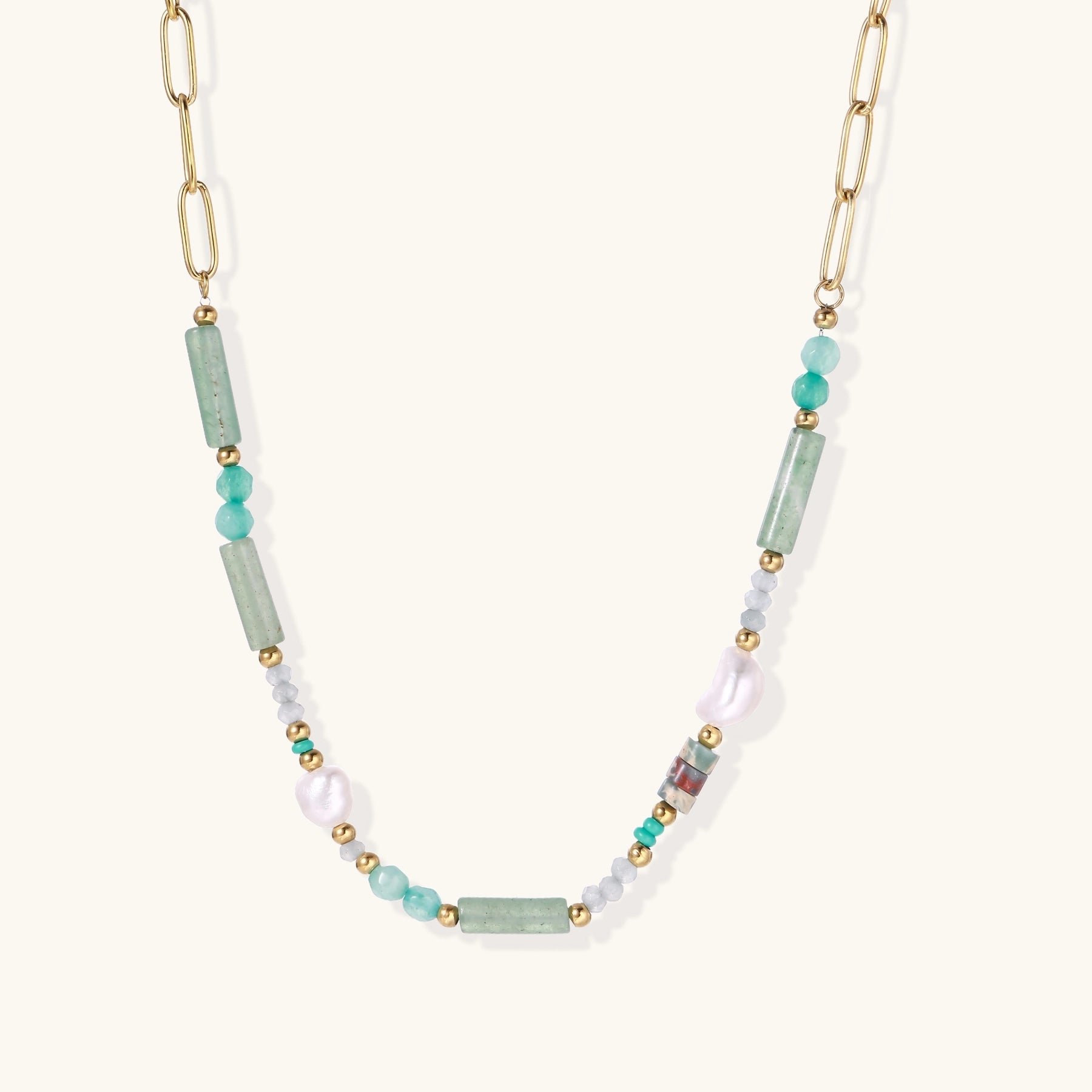 Gold-plated chain necklace with green prasem quartz, freshwater pearls, and mixed beads in modern asymmetrical design